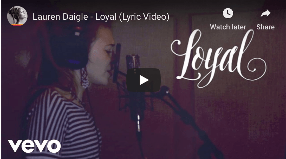 Lauren Daigle singing into microphone | Relationship Advice Coaching