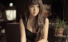 Beautiful young asian woman in classy black dress