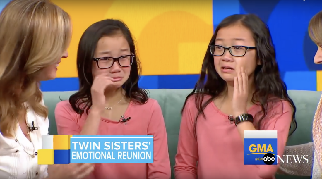 Asian girls twins crying because they met for first time in life.