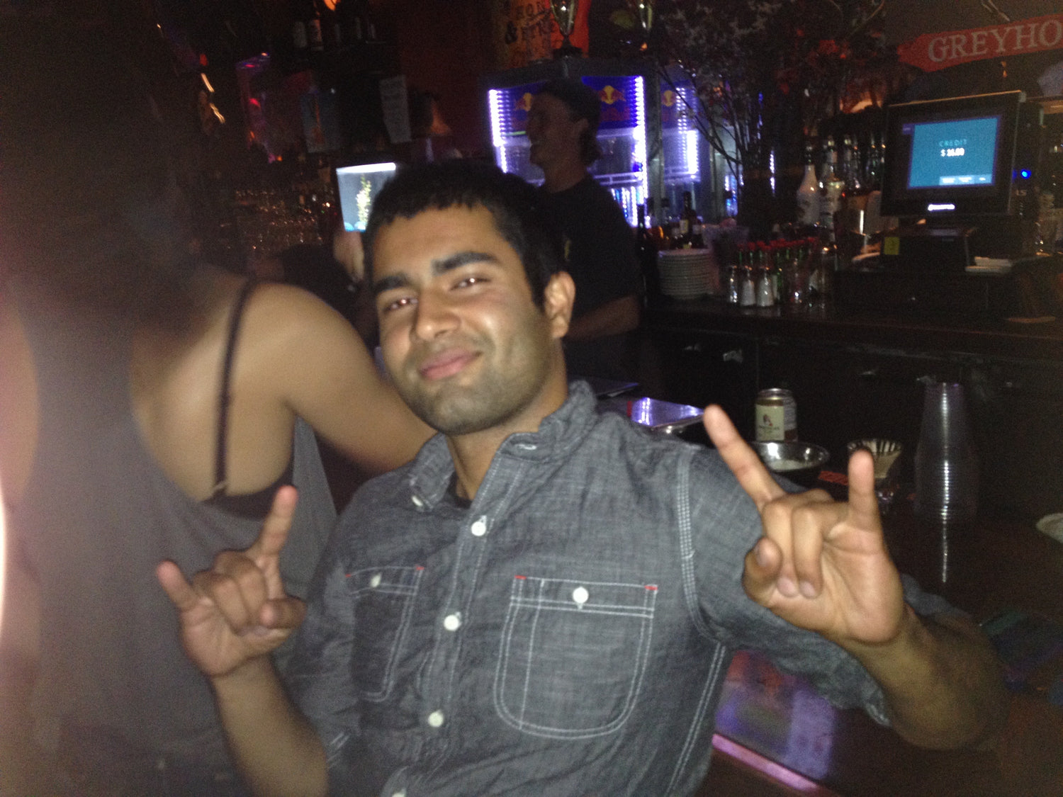 Dating and Pickup Artist Expert | Abhinav, Indian Guy sitting at Club in San Francisco with a Huge Smile