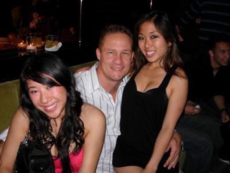 Elite Dating tips and Relationship Coaching | Mike Kollin with 2 Cute Asian girls in their mid 20's, one sitting on Mikes Lap, at The Matrix Club in San Francisco