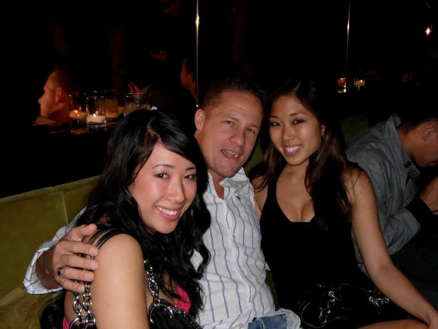 Dating Relationship Pickup artist coach at the club with 2 Cute Asian girls sitting with him at the Matrix Club San Francisco